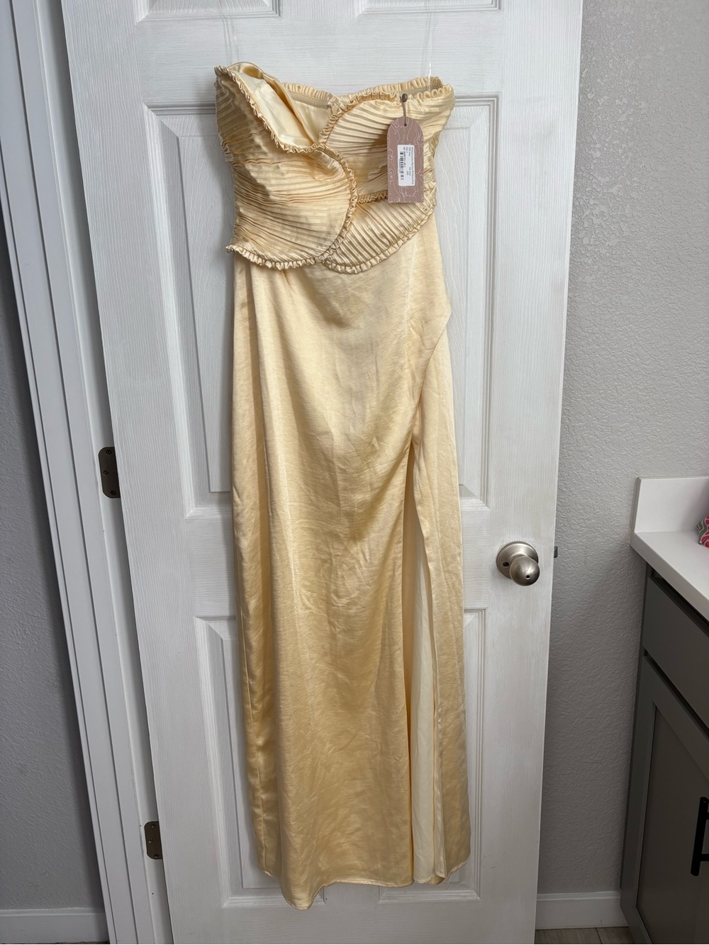 Meshki Strapless Maxi Gown in Pale Yellow with Pleated Ruffle Bodice
